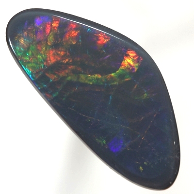SOLID BLACK OPAL Fishscale Harlequin pattern showing red through to royal blue